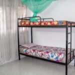 a-bed-with-a-mosquito-net-scaled